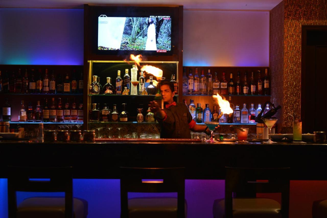 Ramada Plaza Chennai Hotel Exterior photo A bartender at work