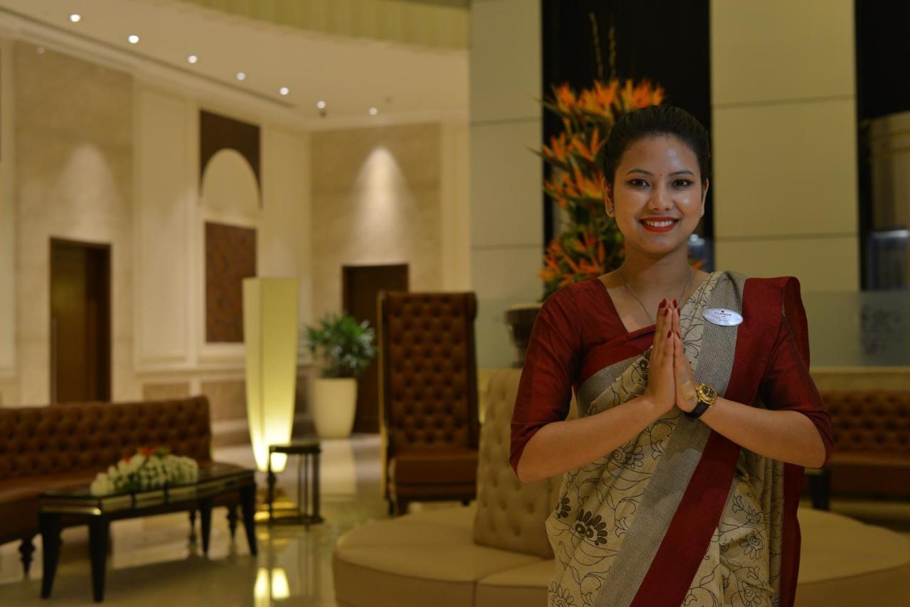 Ramada Plaza Chennai Hotel Exterior photo A hotel staff in India